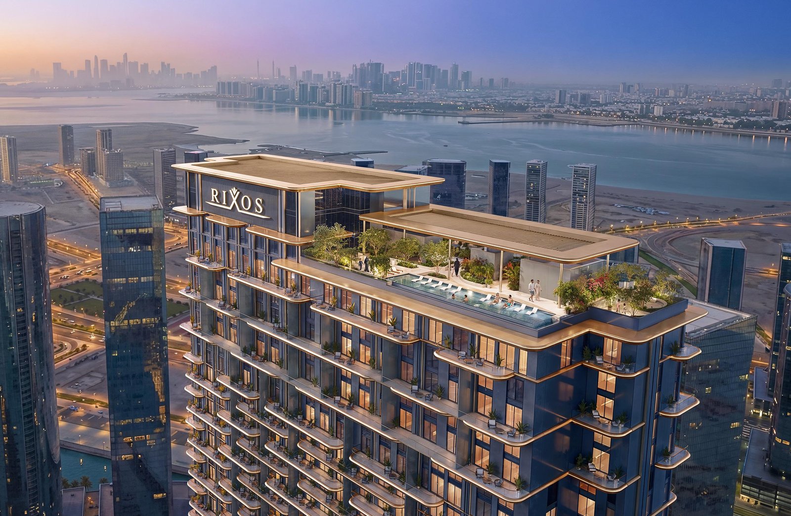 A panoramic exterior view of Rixos Al Reem Residences in Abu Dhabi highlighting its prime coastal location and luxury tower structure